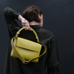 stylish leather bag held over shoulder