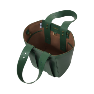 green leather handbag open from top view showing suede inner lining and functional pockets