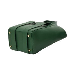 green leather handbag lying on side showing four metal studs on bottom to protect bag