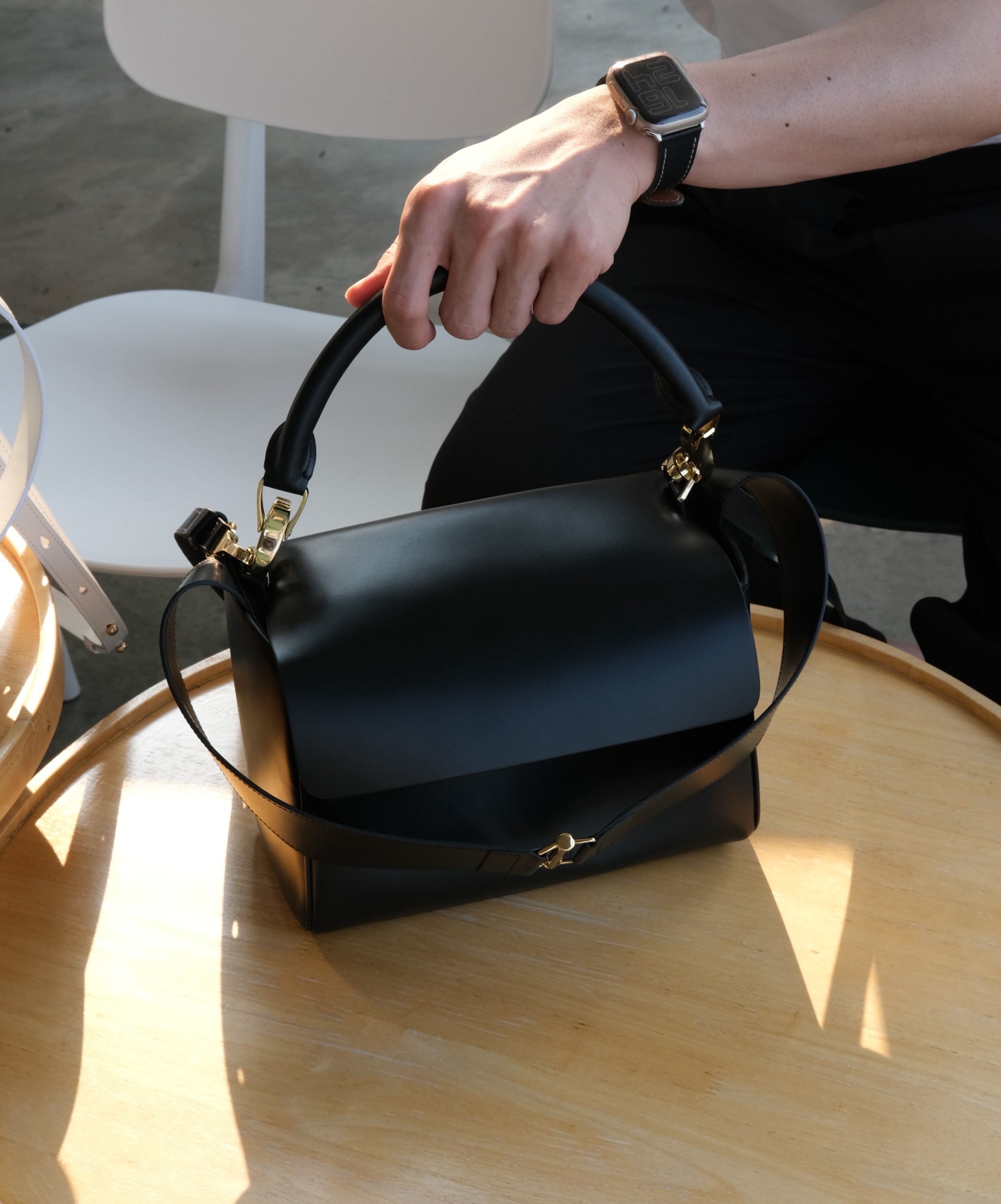 Functional handbag sat on table- for every day use